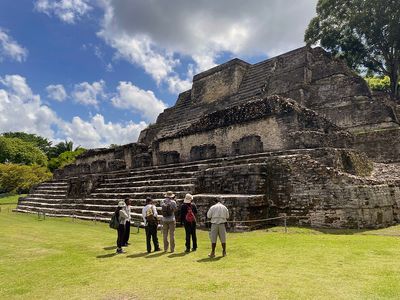people in front of mayan temple