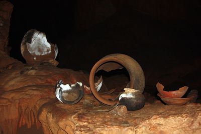 broken mayan pottery in cave