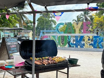 barbecue grill with meat and vegetables on it