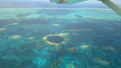 Great Blue Hole flight point of view by Kerstin Wallner plane point of view of blue hole at sea