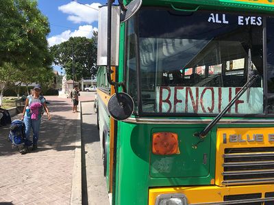 Benque Bus that passes in front of Xunantunich bus with benque label