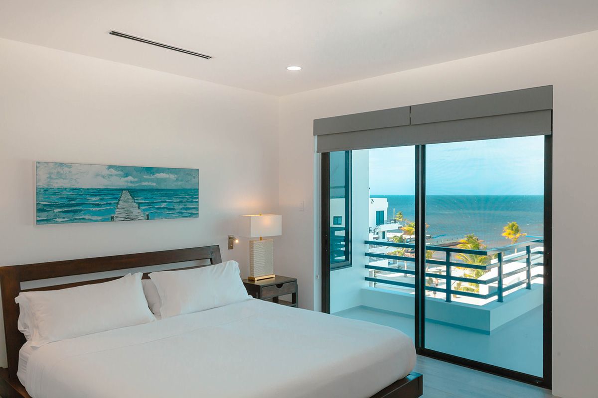 clean bedroom design with patio and view