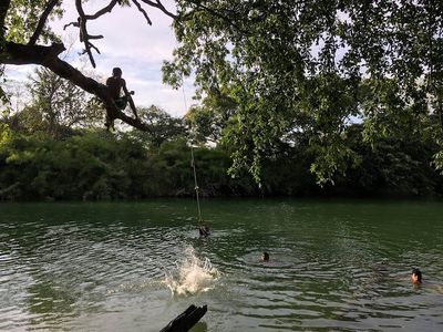 kids swimming at river