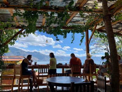 tourists at cafe patio with lake view