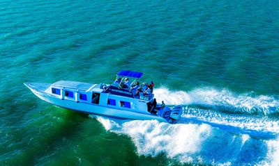 Caribbean Sprinter Vessel boat vessel at sea with waves in the back