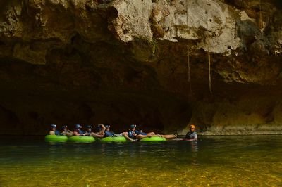 group of tourists cave tubing