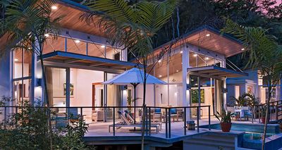 modern villas with large open windows and jungle background