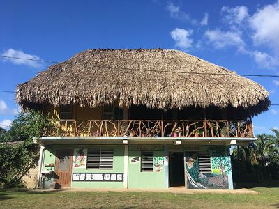 thatch house with mayan painting