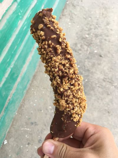 banana covered in chocolate and nuts