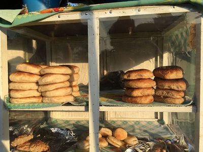 local bread displayed in wood shelf