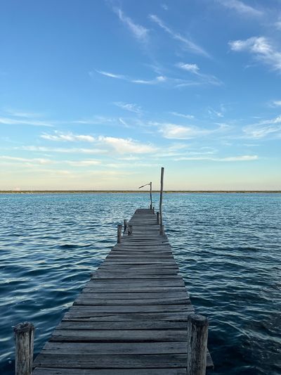 Picturesque Bacalar Dock old dock on blue lagoon