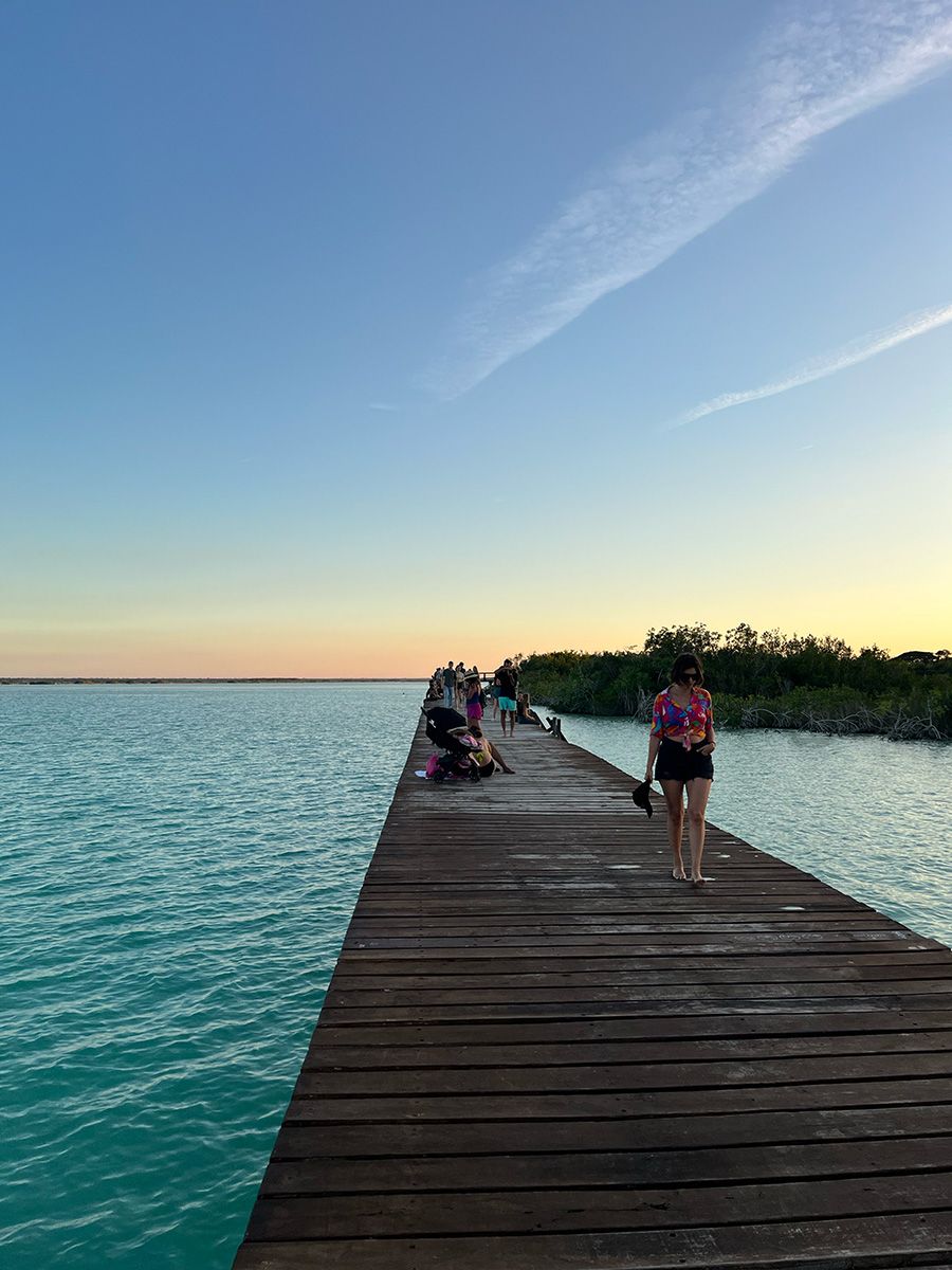 boardwalk for sunset with woman walking