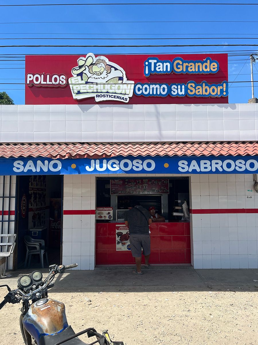 storefront with pollos sign