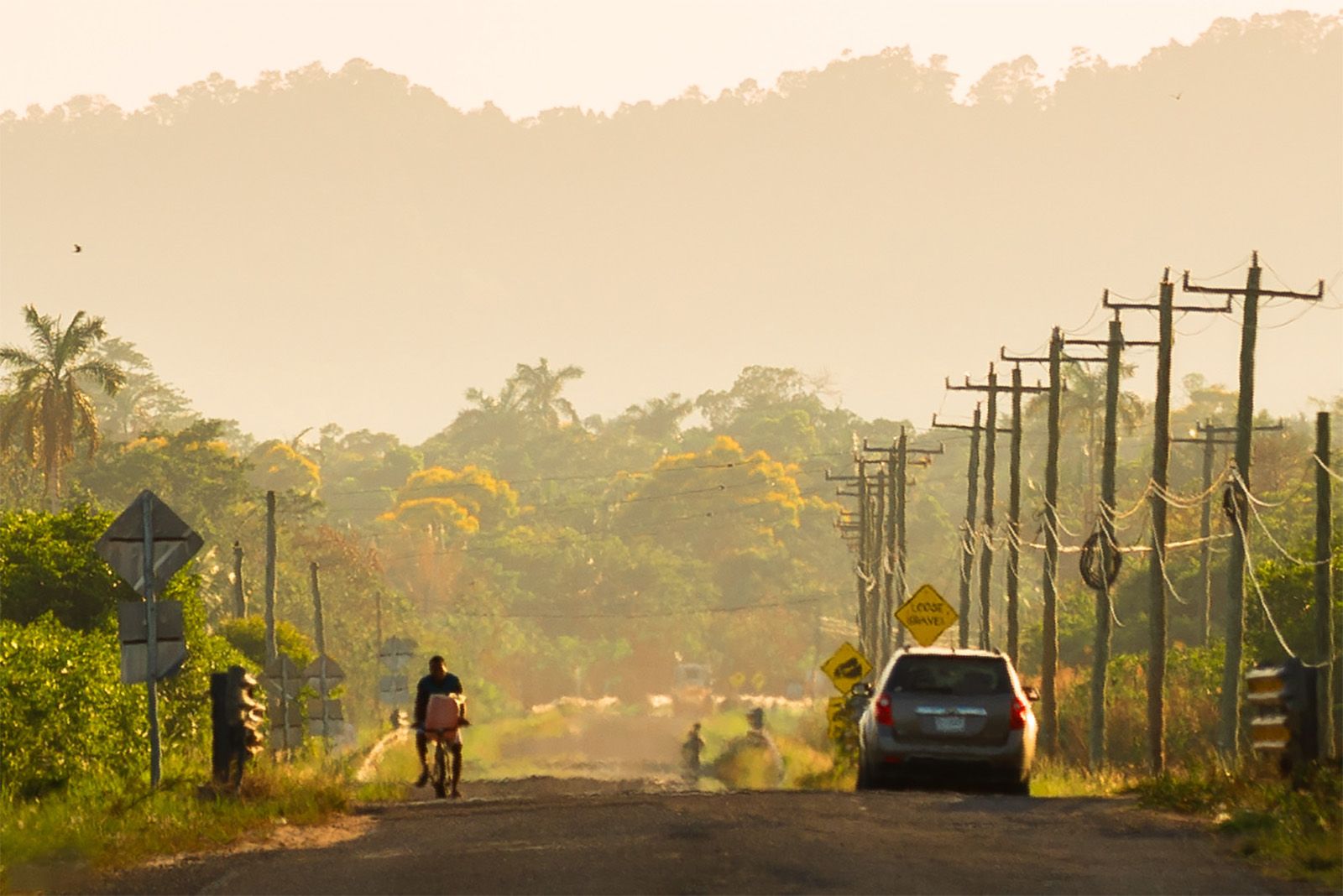 man riding bicycle on street on hot red day