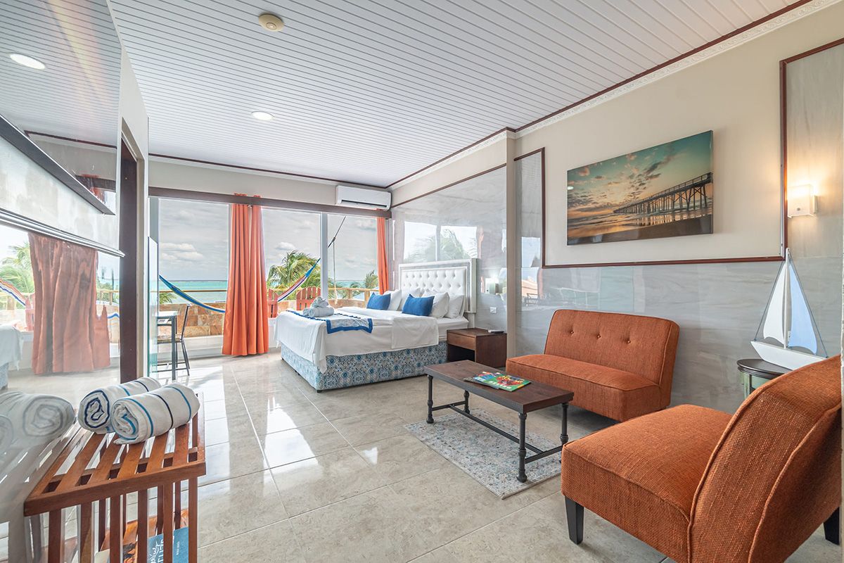 well lit bedroom with orange furniture