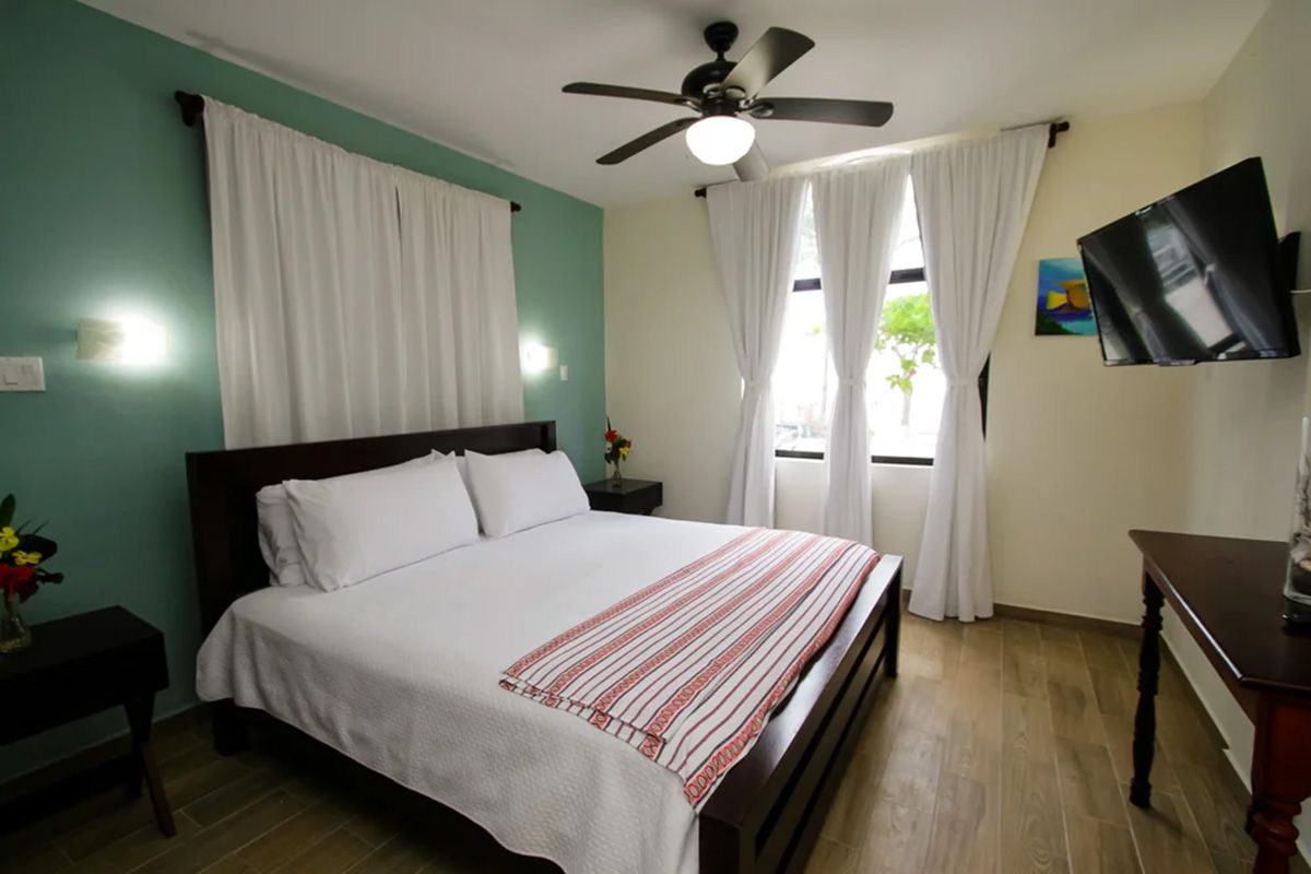clean room with bed and tv