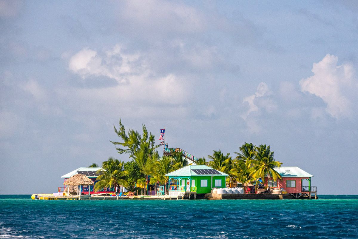 small island with colorful houses and trees