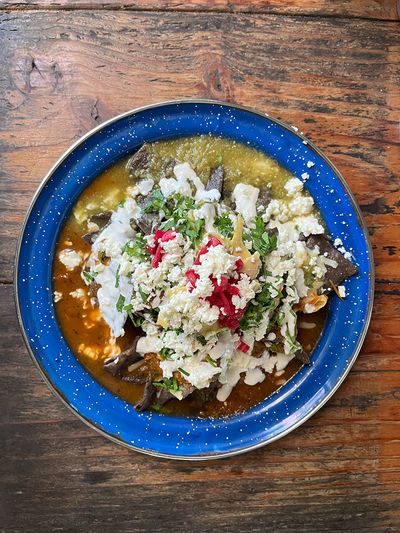 Chilaquiles from La Casa de Lauu mexican dish with tortillas sauce and cheese