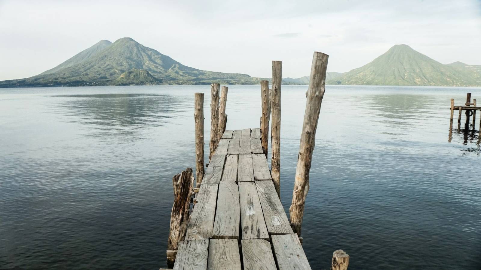 big lake with volcanos in the background