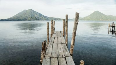 big lake with volcanos in the background