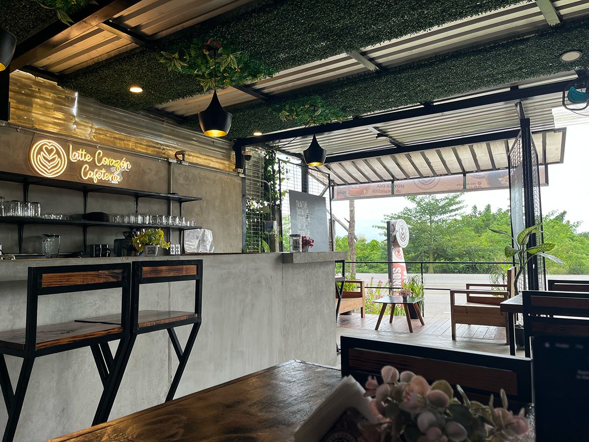modern coffee shop with chairs and sign