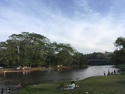 town locals chilling by the river-side