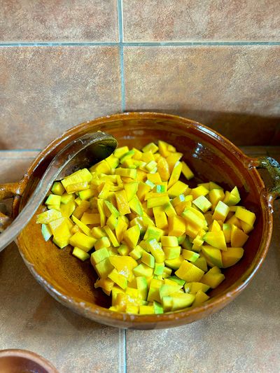 Quick mango snack during cooking class sliced mango in traditional bowl