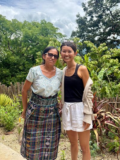 Maria from Maya Magic School with her student happy sudent with teacher in outdoor clasroom