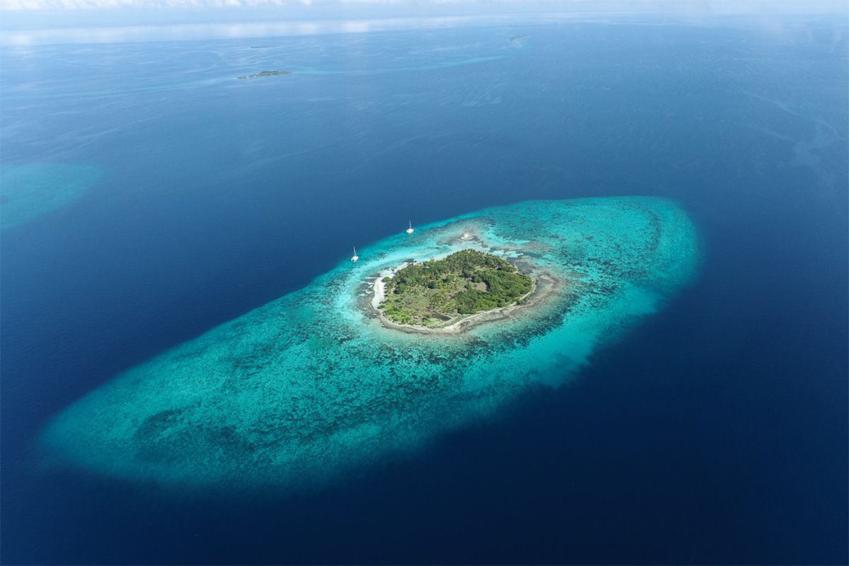 small island with beautiful sea water surrounding it