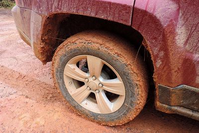 tires with orange mud stuck to it