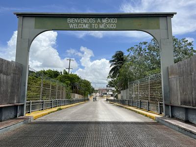 Old Border entering Mexico from Belize bridge entrance sign to mexico