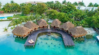 over water bungalows with thatched roofs