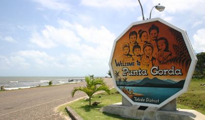 hexagon cement sign with punta gorda written and sea as backdrop