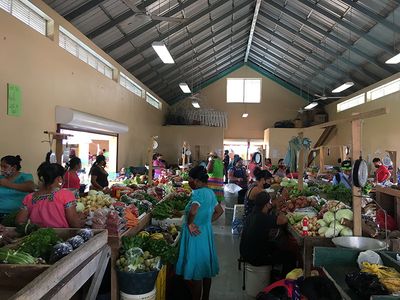 women dressed in traditional clothes in indoor market