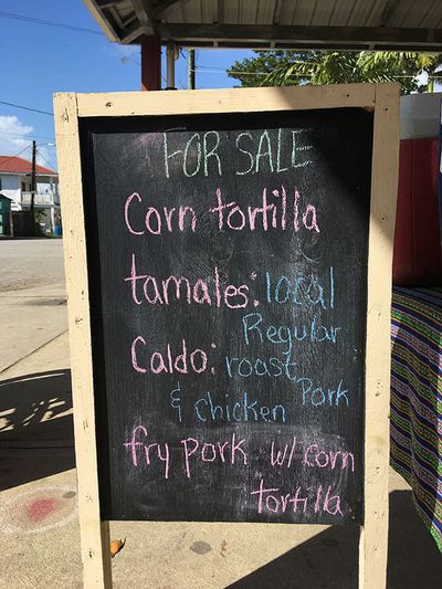 blackboard sign with listing of mayan food