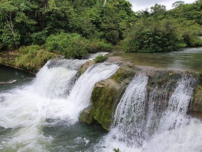 20 foot waterfall with raging waters