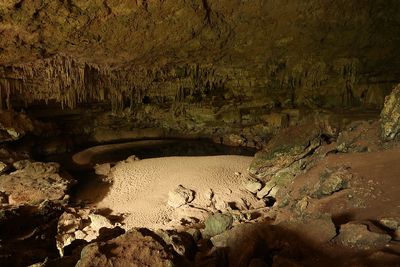 small sandy beach area inside cave