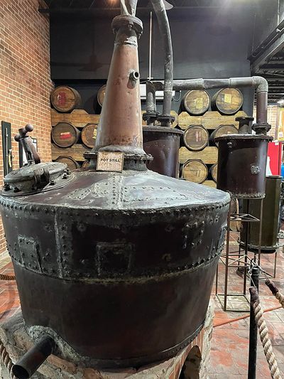 large black tank in rum factory