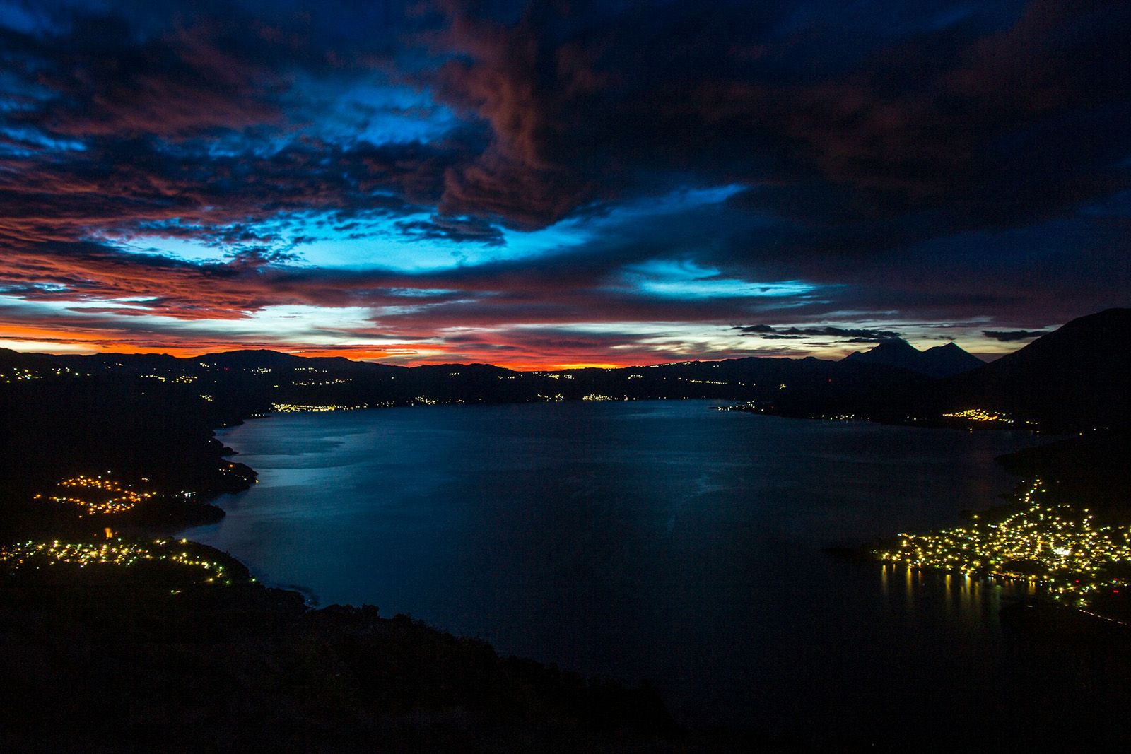 lake side at sunset with lights at night