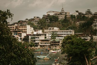 town by lagoon coast surrounded by trees