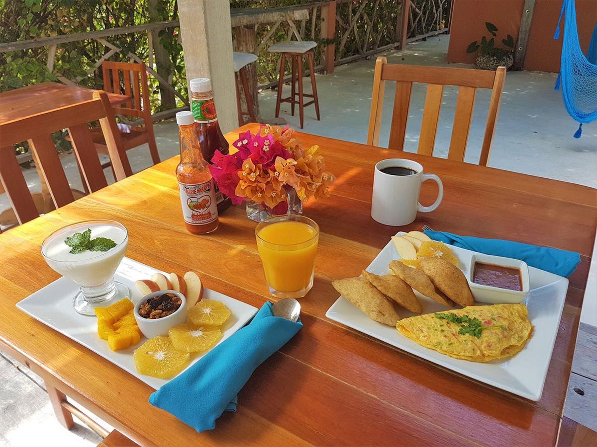 colorful breakfast on table with juice and coffee