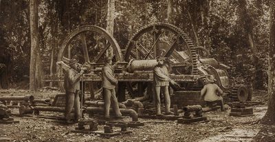 aged sugar mill with workers