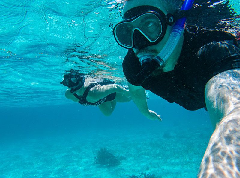 couple snorkeling side by side