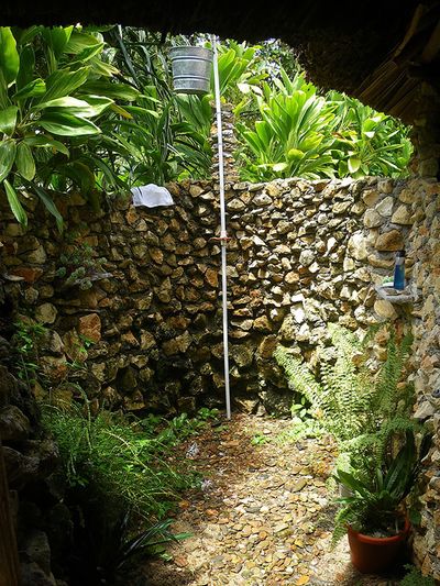 outdoor shower with stone wall