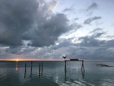 sun setting on a caye