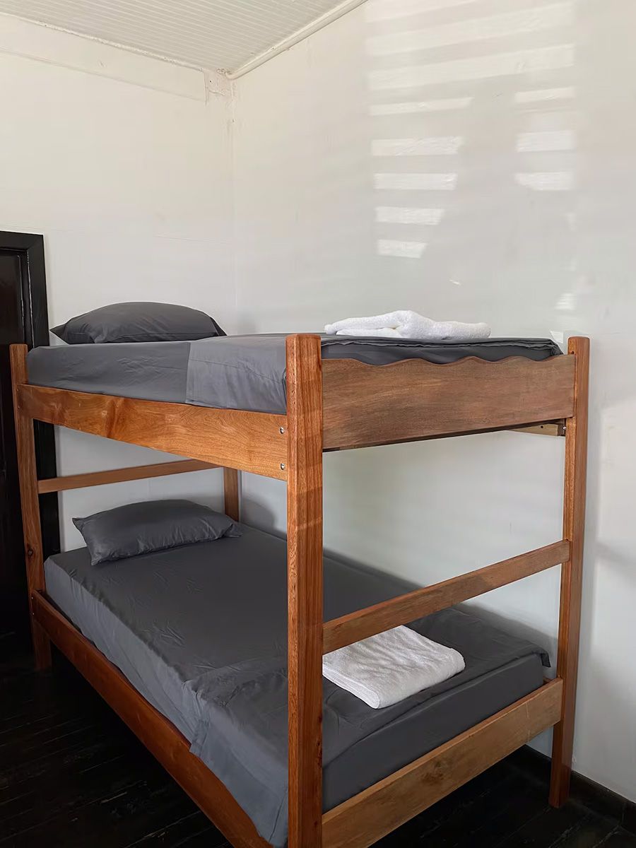 bunk bed with grey sheets