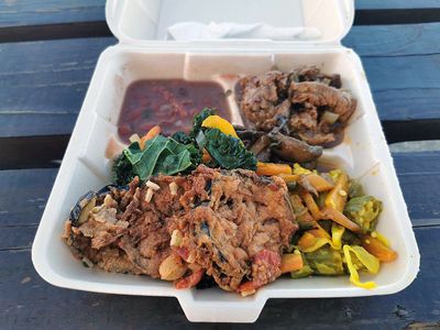 fried zucchini and curry veggies on styrofoam plate