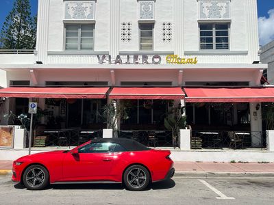 Viajero Hostel in Miami Beach hostel building with red car parked in front