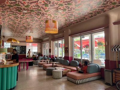 Viajero Hostel Lobby in Miami Beach hostel lobby with couches and mural on rooftop