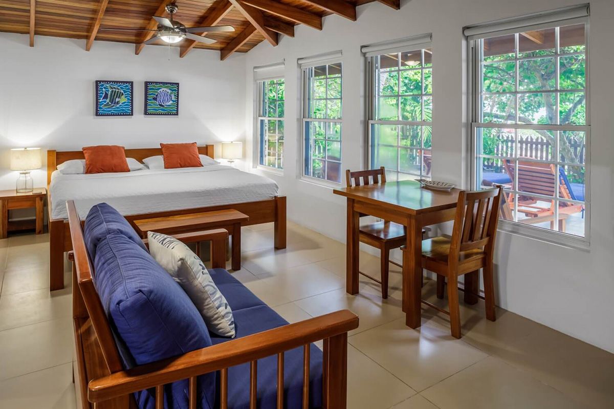 queen size bed with fancy furniture beside it